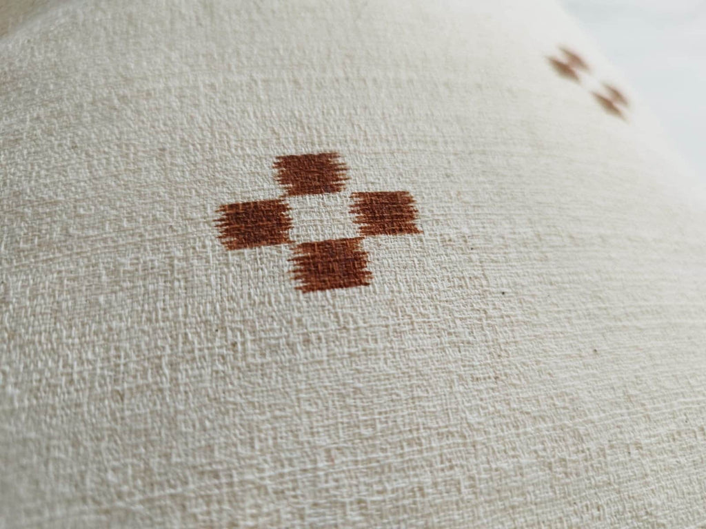 extra long rust patterened lumbar pillow cover, with buttoned reverse
