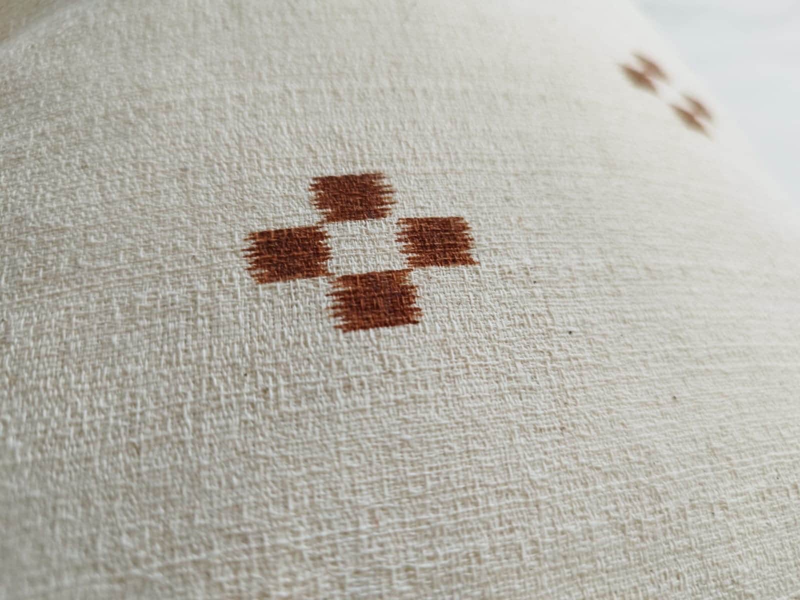 extra long rust patterened lumbar pillow cover, with buttoned reverse