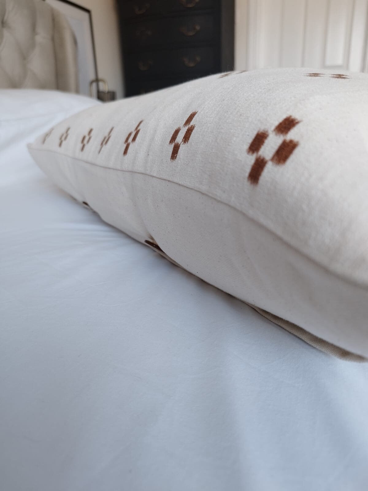 extra long rust patterened lumbar pillow cover, with buttoned reverse