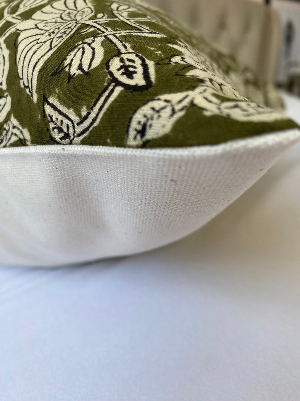 olive green block print cotton cushion covers, with an organic cotton reverse