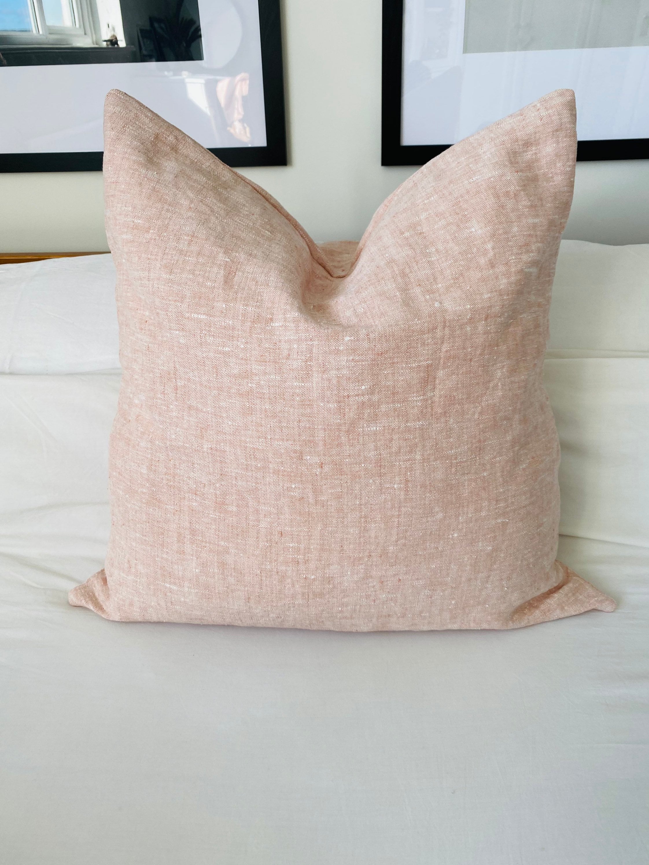 Blush pink textured linen cushion covers, with an envelope reverse