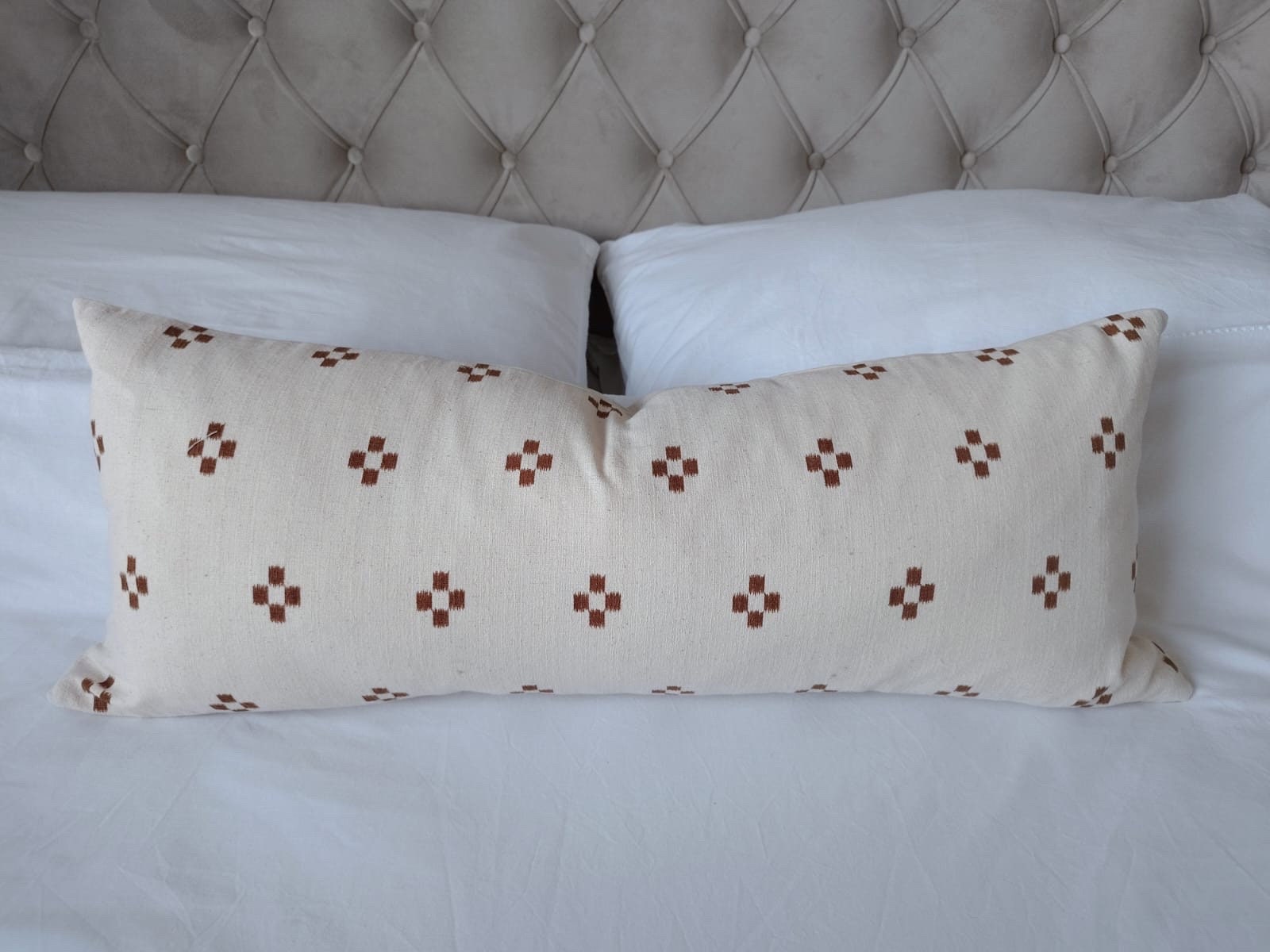 extra long rust patterened lumbar pillow cover, with buttoned reverse